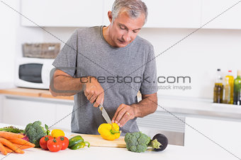 Man cutting pepper