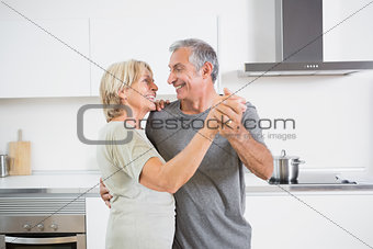 Smiling couple dancing together
