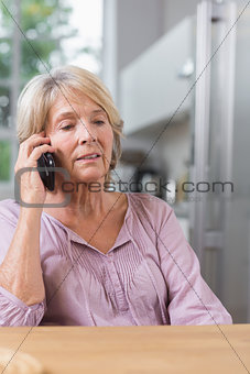 Serious mature woman calling
