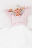 Smiling woman in bed
