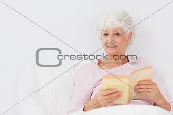 Happy woman with book