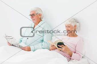 Couple reading in bed