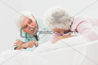 Chatting couple in bed