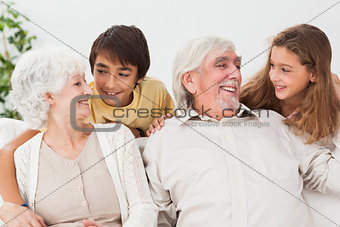 Grandparents with grandchildren on the couch
