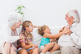 Children playing with grandparents