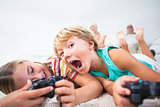 Brother and sister playing video games and having fun