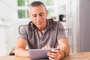 Happy man using tablet