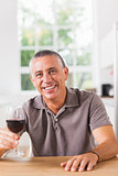 Man holding glass of red wine