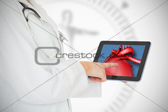 Doctor showing her tablet with red heart