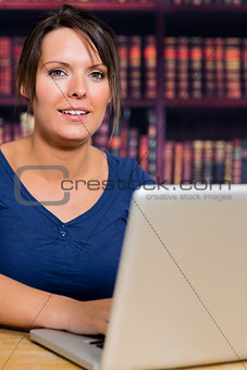 Smiling girl with a computer