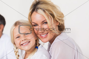 Mother embracing young daughter