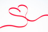 Pink ribbon in heart shape
