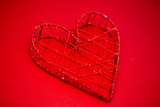 Heart shaped box on red background