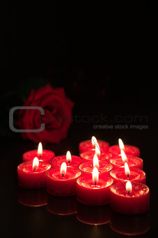 Romantic candles with red rose