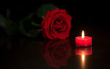 Romantic candle with red rose