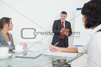 Businessman writing on his notepad