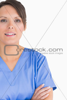Portrait of smiling nurse with arms crossed