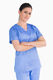 Nurse with tied hair and arms crossed