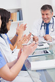 Nurses applauding a doctor