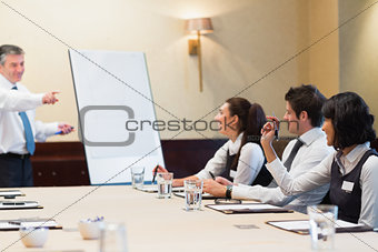 Woman asking question during business presentation