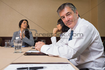 Happy businessman at meeting