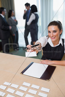 Woman handing you a name tag