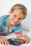 Smiling boy using a tablet
