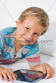 Smiling boy using a tablet