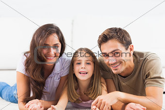 Family lying on a carpet
