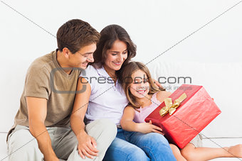 Parents offering a gift