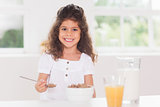Little girl eating cereal