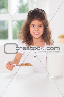 Little girl having cereal