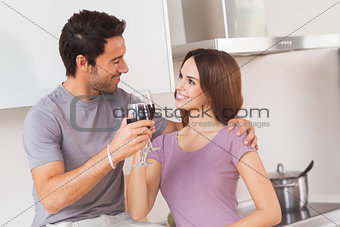 Lovers toasting with a glass of wine