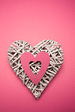 Wicker heart ornament with pink paper cut out