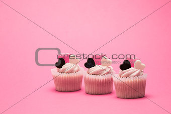 Tasty valentines cupcakes in a row
