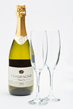 Bottle of champagne with two flutes