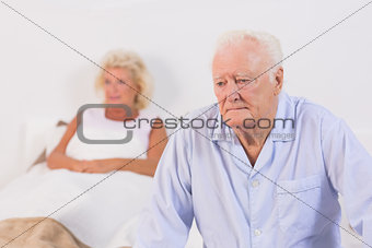 Unsmiling old couple