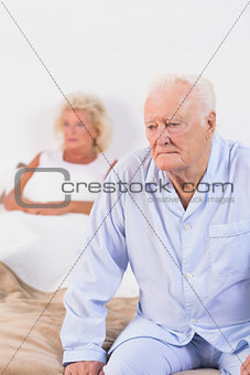 Elderly couple on a bed