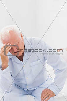 Aged man suffering while woman sleeping