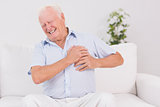 Old man suffering with heart pain