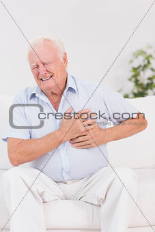 Aged man suffering with heart pain