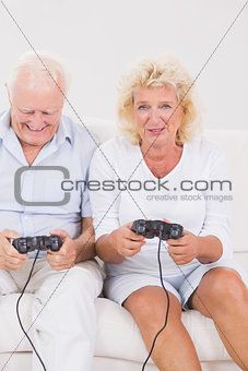 Old couple playing video games