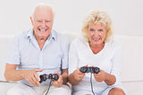 Aged couple playing video games