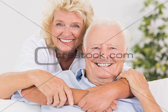 Happy old couple portrait hugging