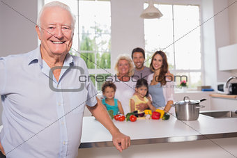 Grandfather in front of his family