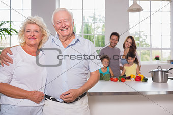 Grandparents in front of their family