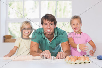 Smiling family with baking tools