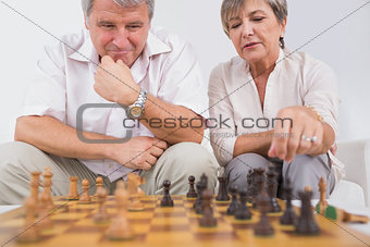 Old lovers playing chess