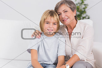 Portrait of a little boy and his grandmother smiling