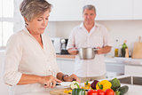 Old couple preparing food